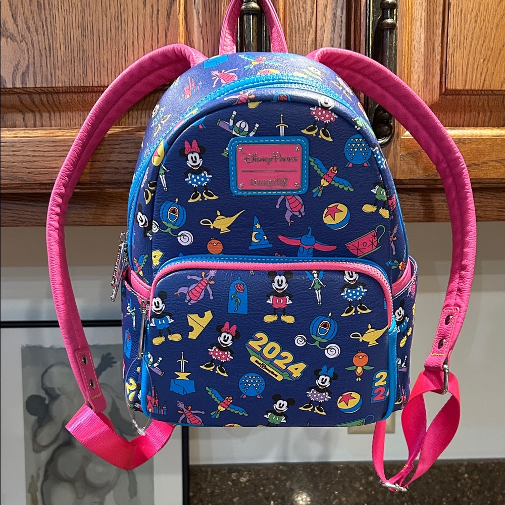 No longer available. NWT Loungefly Disney Kids Backpack - Navy and Pink